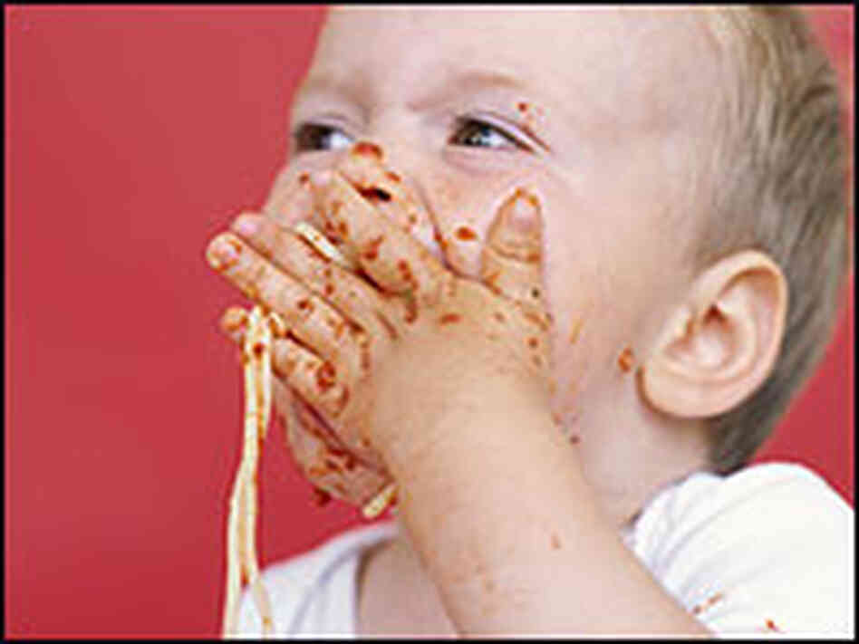 A baby eating spaghetti A baby eating spaghetti