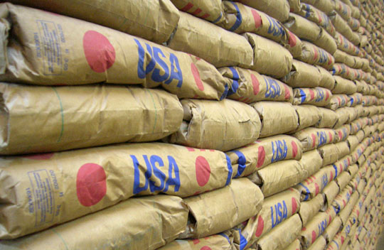 Bags of U.S. cornmeal are stacked in a Malawi warehouse.