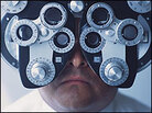 A patient undergoes an eye exam. A patient undergoes an eye exam.