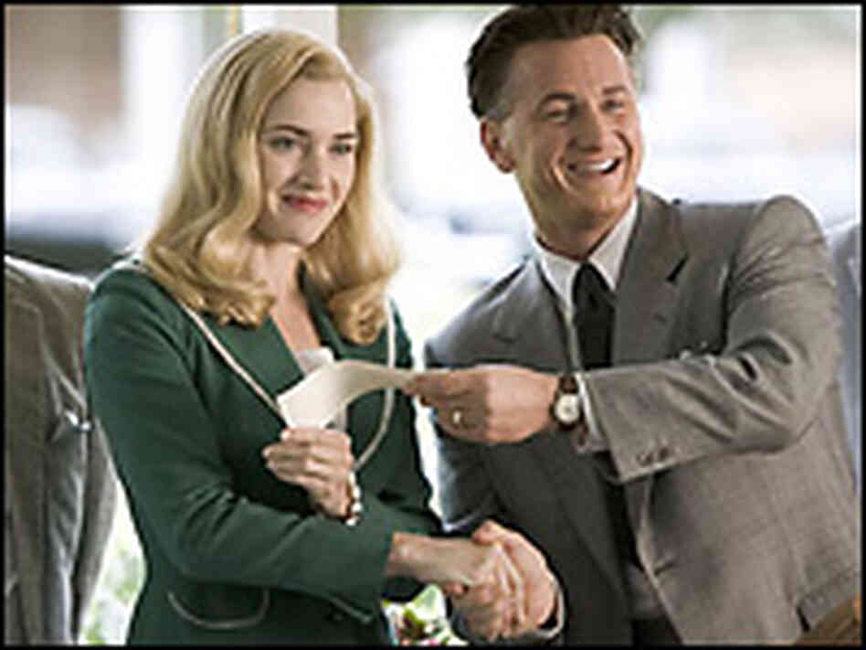 Kate Winslet and Sean Penn. Credit: Columbia Pictures. Kate Winslet and Sean Penn. Credit: Columbia Pictures.