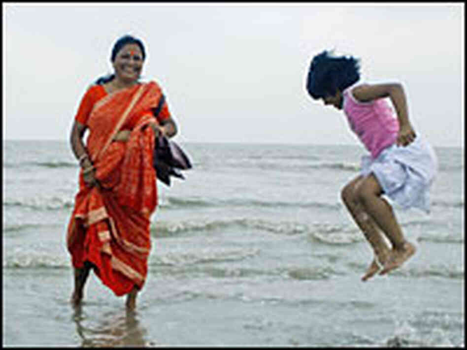 Hindu pilgrims bathe in the water