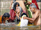 Hindu pilgrims bathe in the holy waters of the Ganges at Varanasi Hindu pilgrims bathe in the holy waters of the Ganges at Varanasi