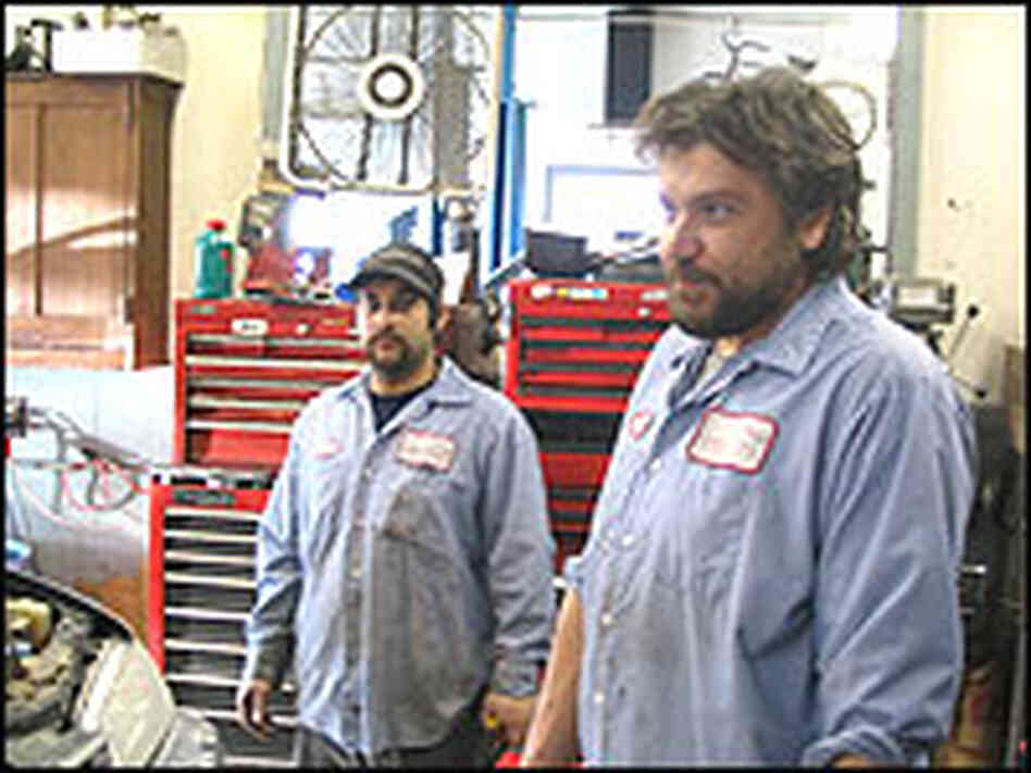 Scott Beverly, co-owner of Flamingo Motors stands in a garage with his employee, Chad Bulger. Scott Beverly, co-owner of Flamingo Motors stands in a garage with his employee, Chad Bulger.