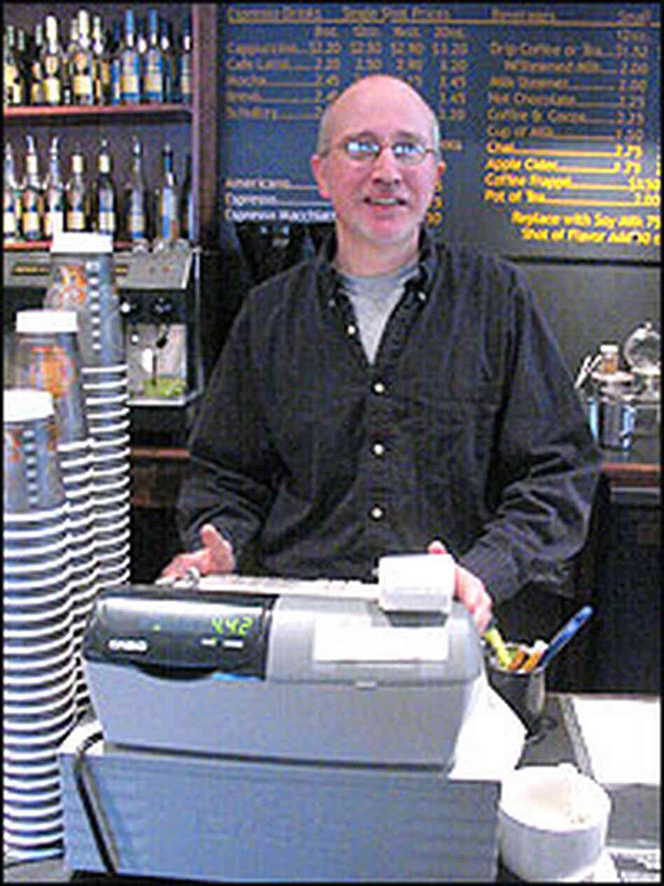 Paul Lovegreen stands behind the cash register at his coffee shop in Williamstown, MA. Paul Lovegreen stands behind the cash register at his coffee shop in Williamstown, MA.