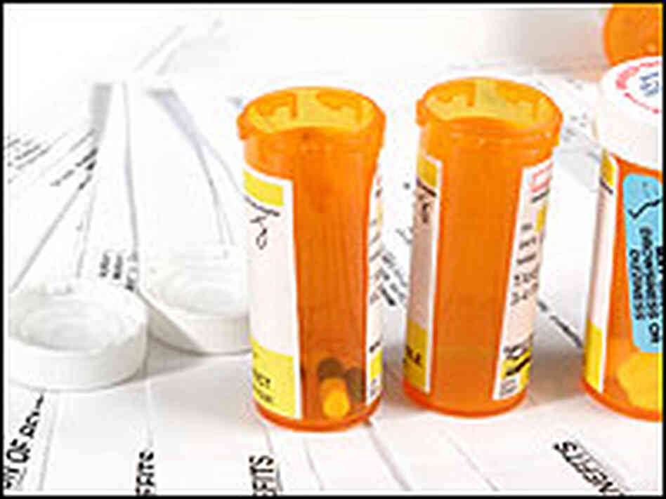 Pill bottles and bills. Pill bottles and bills.