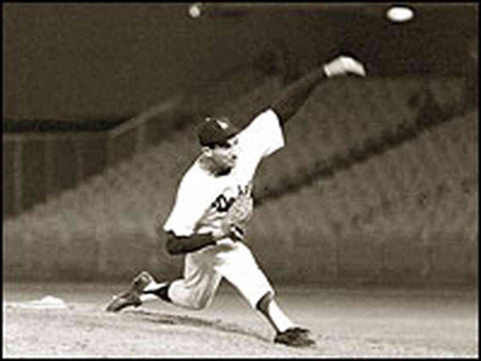 Sandy Koufax throws the game's final pitch.