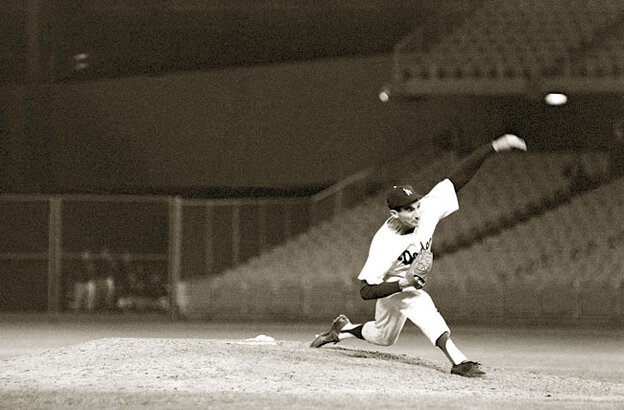 Sandy Koufax throws the game's final pitch.