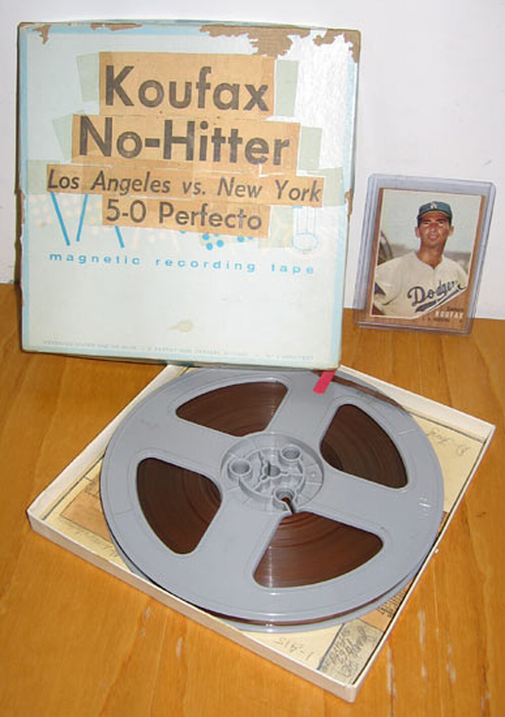 The reel-to-reel tape, box and a Sandy Koufax card.