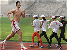 Yao Ming runs around a track in Beijing. Yao Ming runs around a track in Beijing.