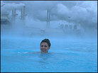 A woman swims at Blue Lagoon A woman swims at Blue Lagoon
