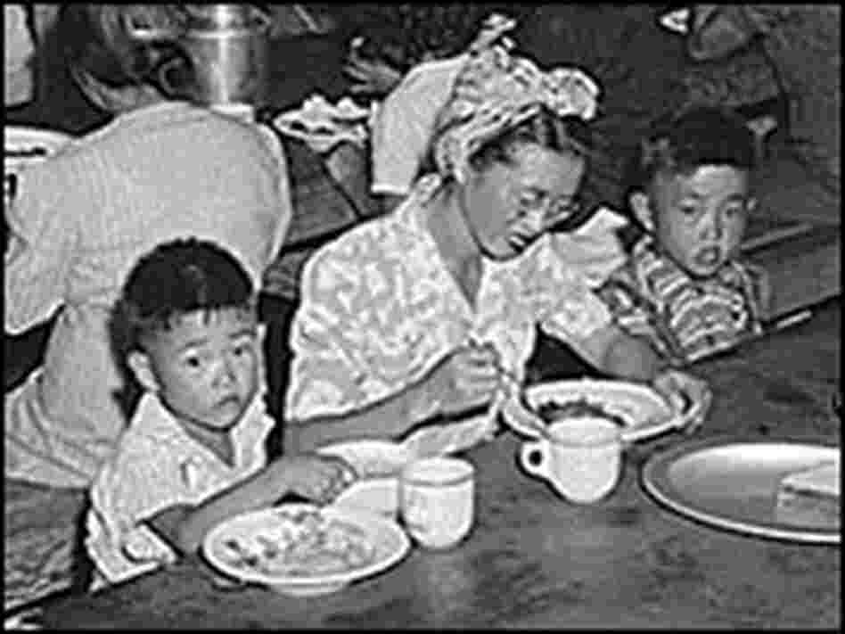 Meal time at a mess hall at the Manzanar internee camp.