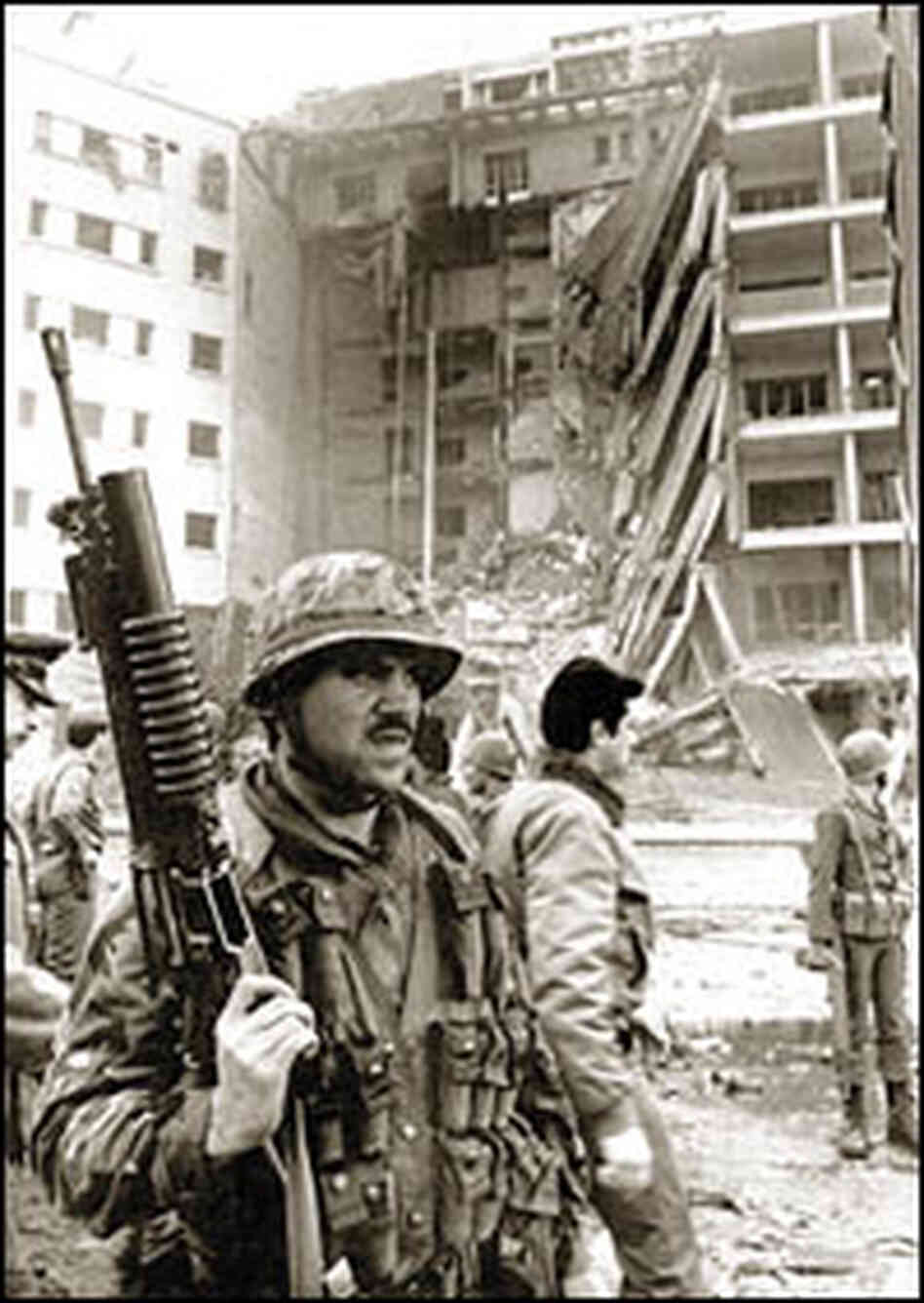 A U.S. Marine stands guard after the U.S. Embassy bombing in Beirut.