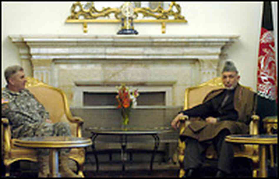 Afghan president Hamid Karzai, Lt. Gen. Karl Eikenberry. Credit: FARZANA WAHIDY/AFP/Getty Images.