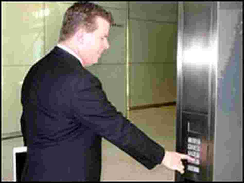 Brian Schwagerl demonstrates an elevator keypad. Brian Schwagerl demonstrates an elevator keypad.