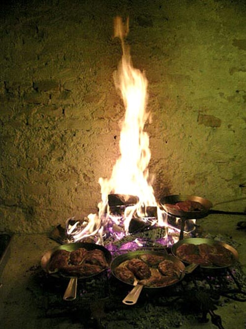 Ducks are cooked over an open fire as part of the festival's Game Kitchen.