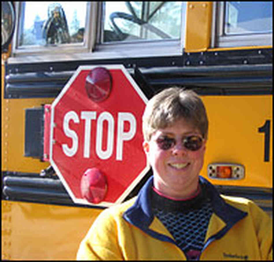Diana Fannion stands next to her bus. Diana Fannion stands next to her bus.