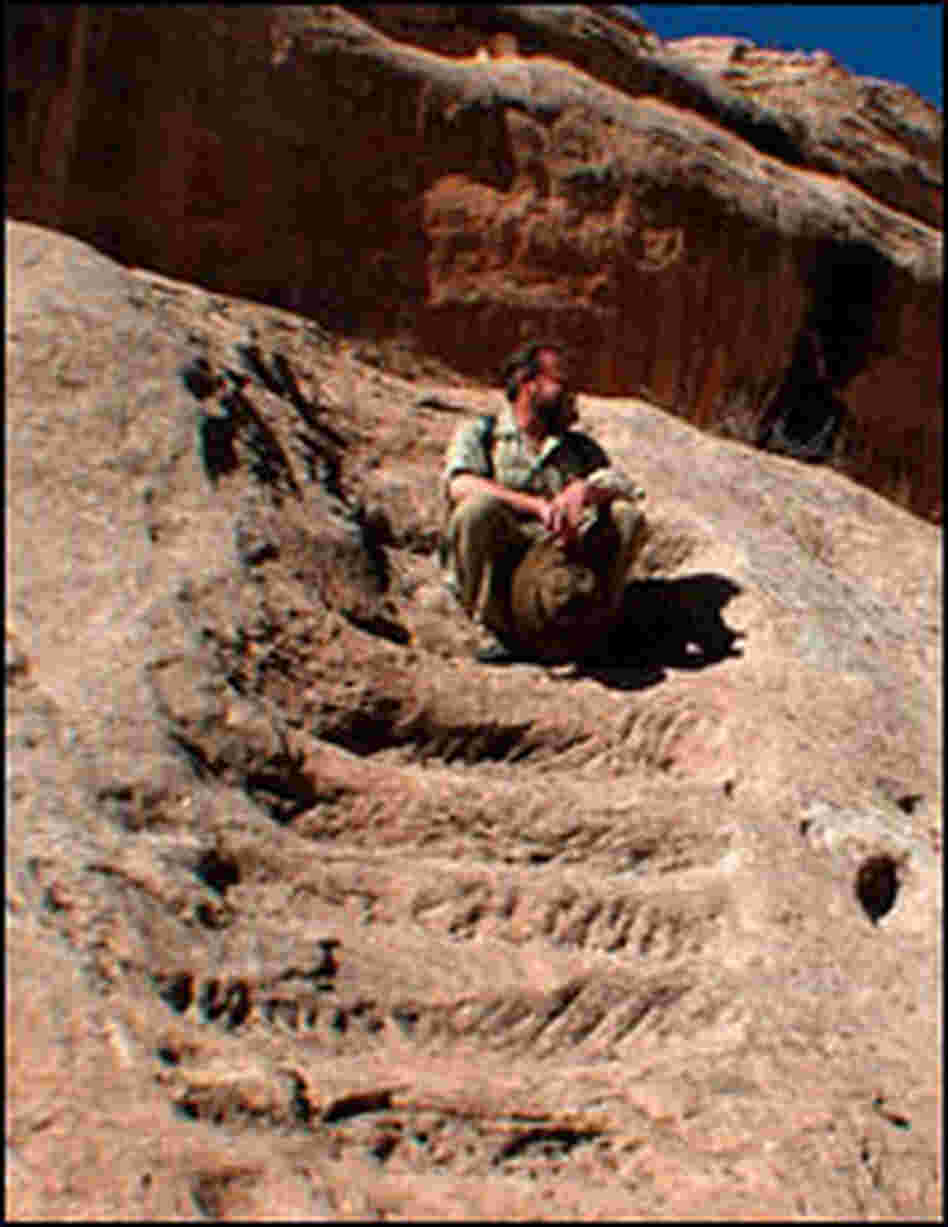 Craig Childs sits on an ancient stairway.