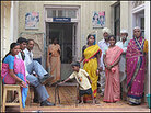 Patients and families stand outside a Bel-Air Hospital building. Patients and families stand outside a Bel-Air Hospital building.