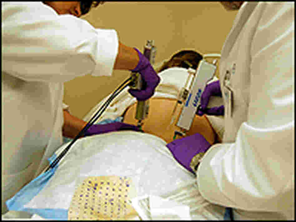 Dr. Roger Friedman injects a compound into the fatty tissue of a patient's back. Dr. Roger Friedman injects a compound into the fatty tissue of a patient's back.
