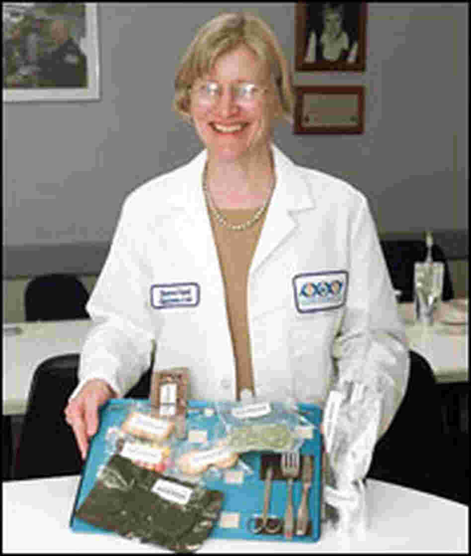 Vickie Kloeris holds a space food tray.