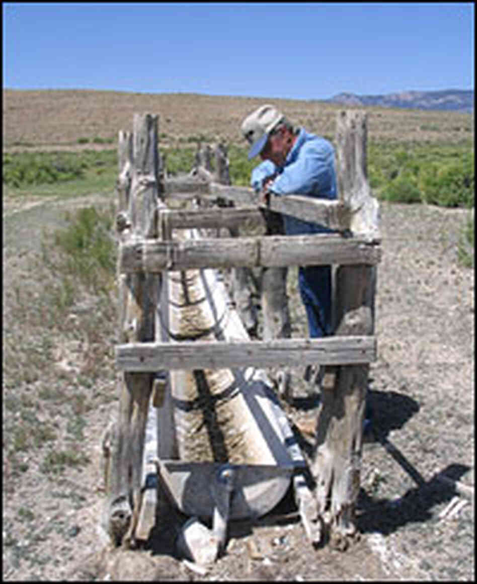 Dean Baker gazes at a waterless trough once used by sheep and wild horses.