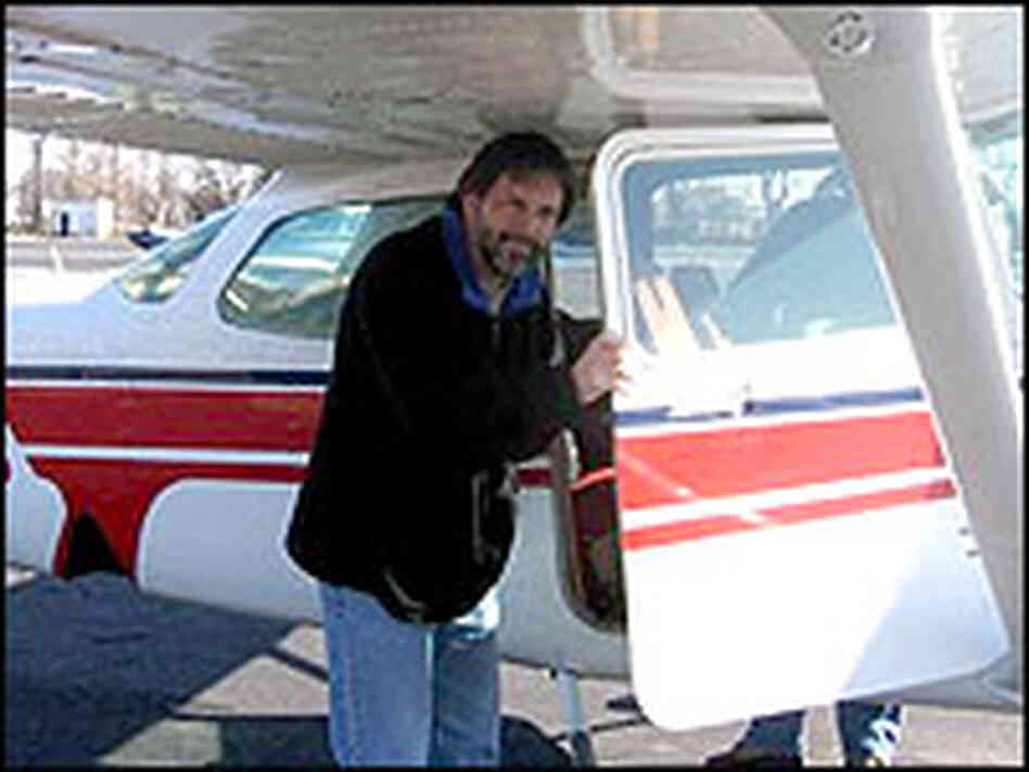 Eagle biologist Bryan Watts boards the small plane he uses to survey bald eagle populations.