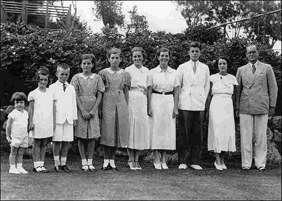 The Kennedy Family stands in a line in a 1937 portrait.