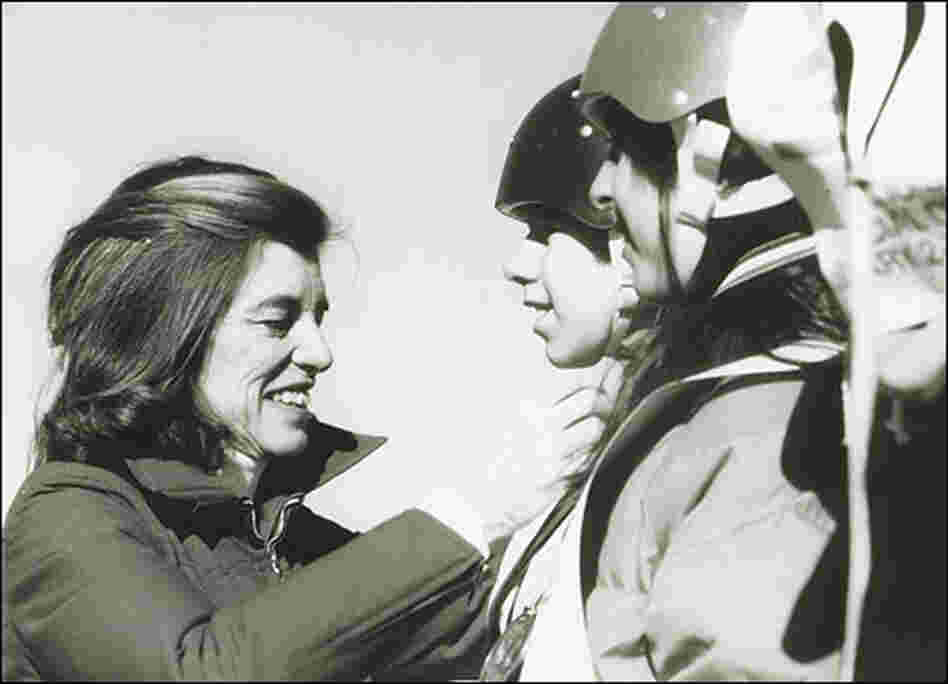 Shriver awards medals to athletes at the Special Olympics in 1968.
