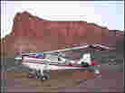 Plane parked near butte