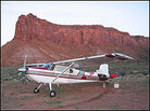Plane parked near butte Plane parked near butte