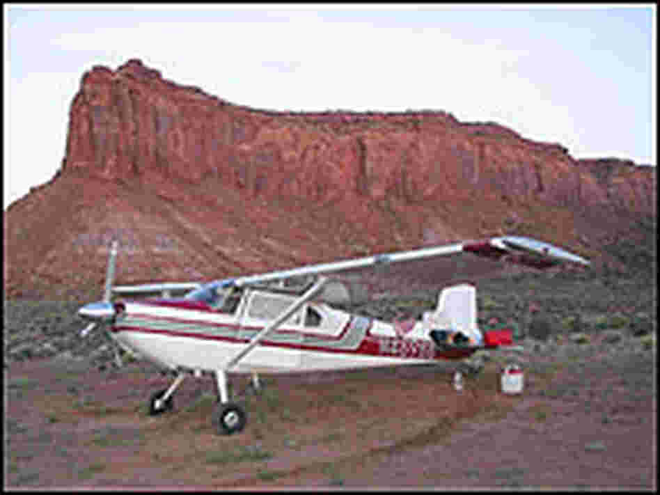 Plane parked near butte
