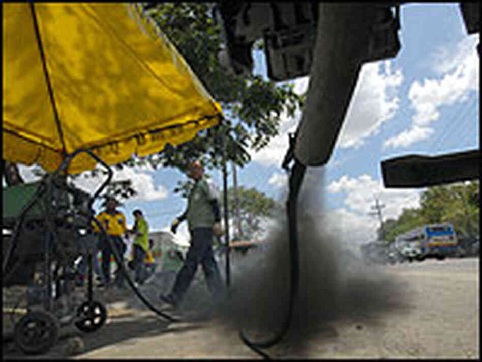 A truck's emissions are tested in Manila, the Philippines. A truck's emissions are tested in Manila, the Philippines.