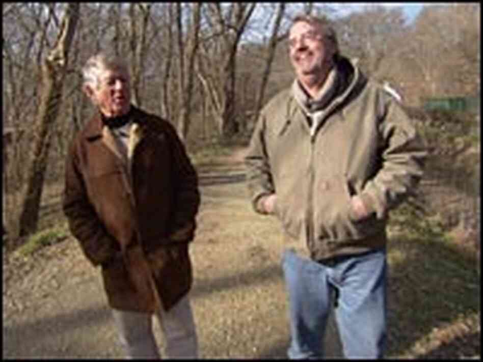 Ted Koppel and Leroy Sievers walk along the C & O Canal.