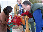 Renee Montagne and Chris Kimball press apples to make cider. Renee Montagne and Chris Kimball press apples to make cider.