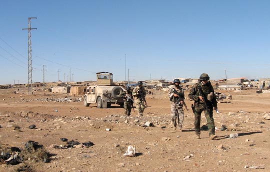 U.S. and Iraqi troops patrol in Mosul.