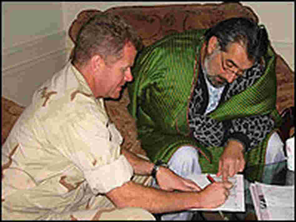 Nuristan Governor Tamim Nuristani and U.S. Navy Cmdr. Sam Papparo