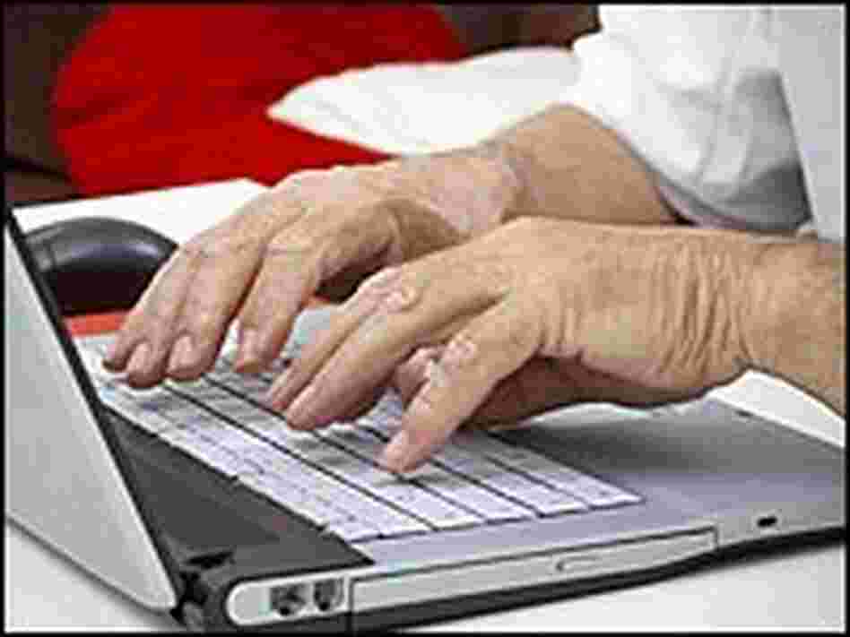hands typing on a laptop computer. hands typing on a laptop computer.
