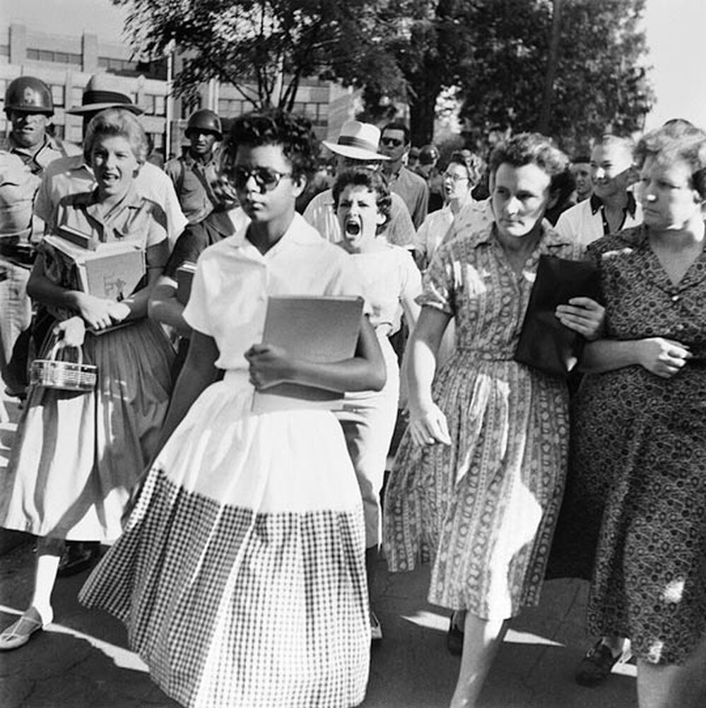 Elizabeth Eckford ignores the hostile screams and stares of adults and fellow students.