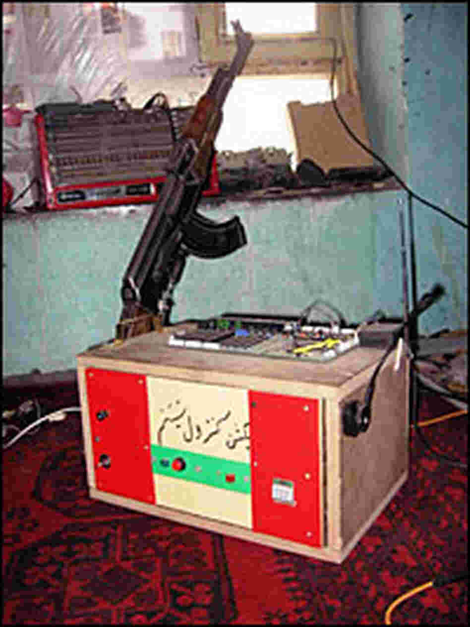 Molavizadeh's burglar alarm is armed with a  Kalashnikov.