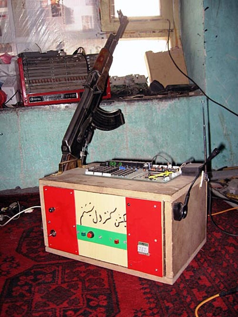 Molavizadeh's burglar alarm is armed with a  Kalashnikov.