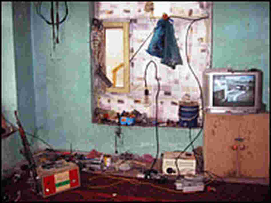 The floor of his one-room home serves as Molavizadeh's workshop.