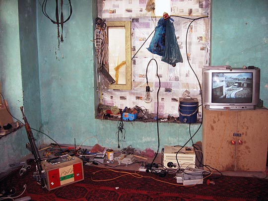 The floor of his one-room home serves as Molavizadeh's workshop.