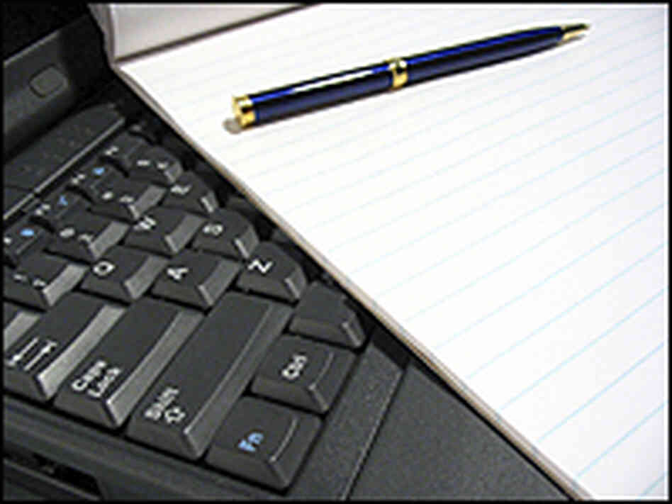 Computer with papers Computer with papers