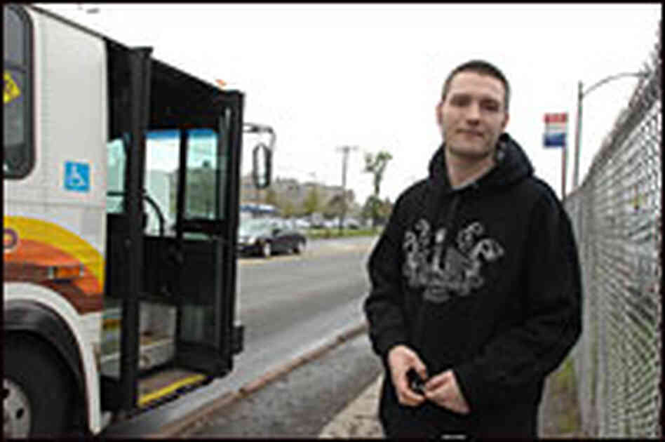 Gary Pettengill waits at the bus stop