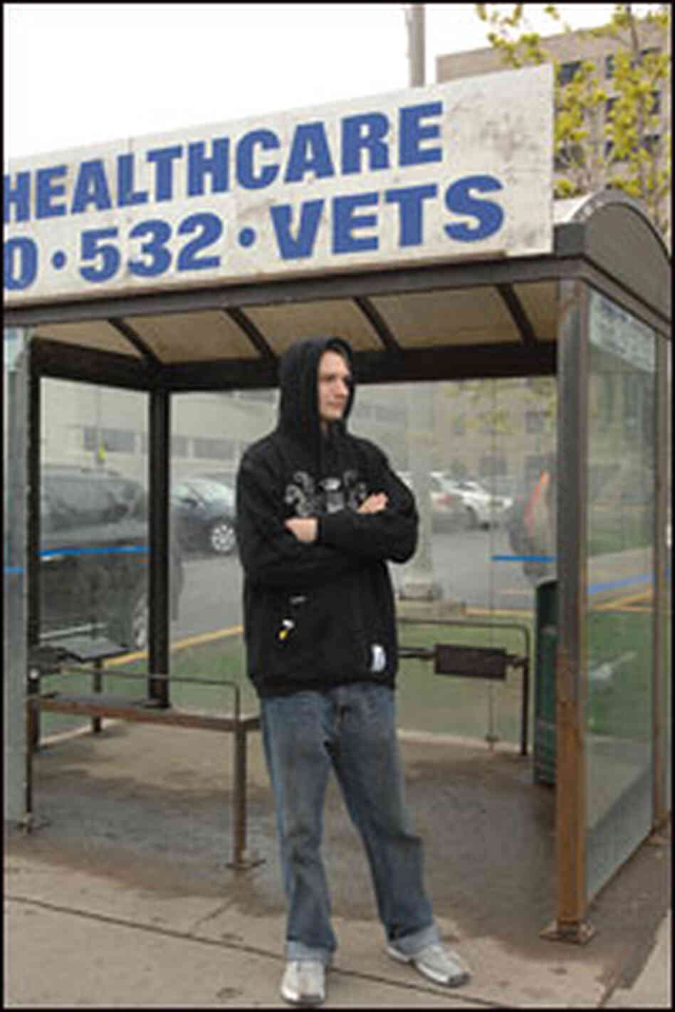 Pettengill waits for the bus outside the VA Medical Center