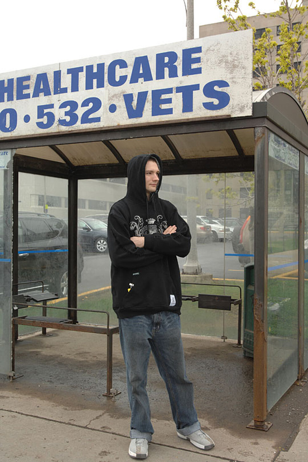 Pettengill waits for the bus outside the VA Medical Center