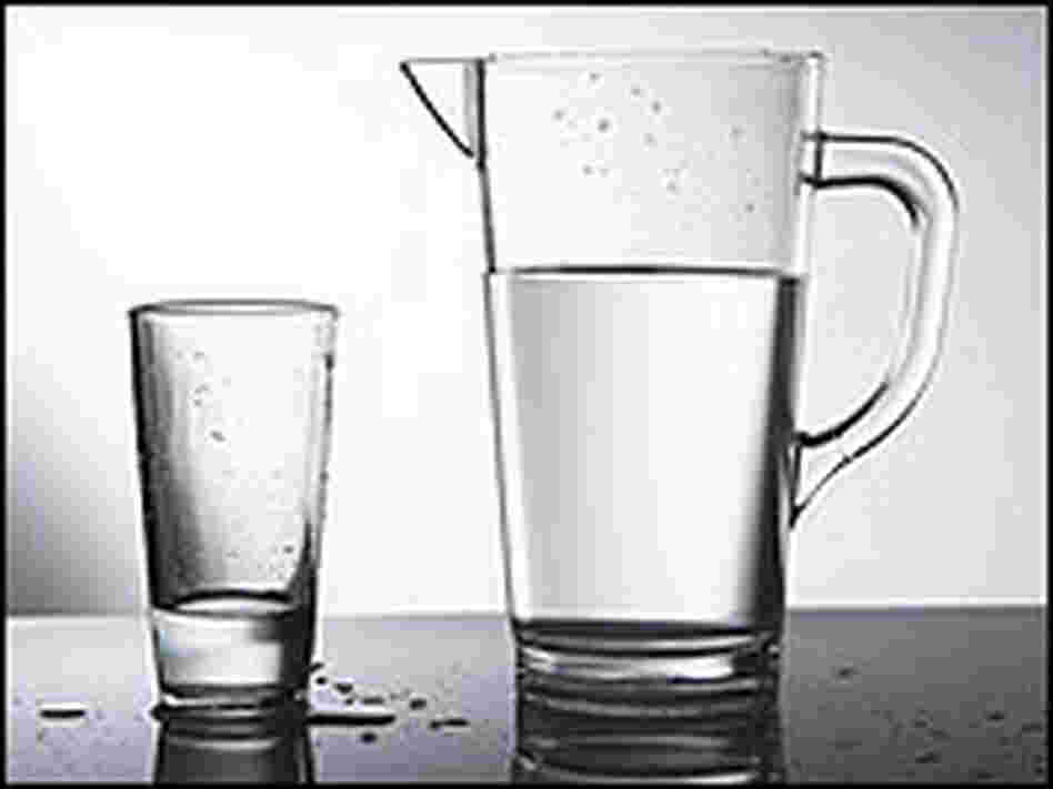 A pitcher and glass of water. A pitcher and glass of water.
