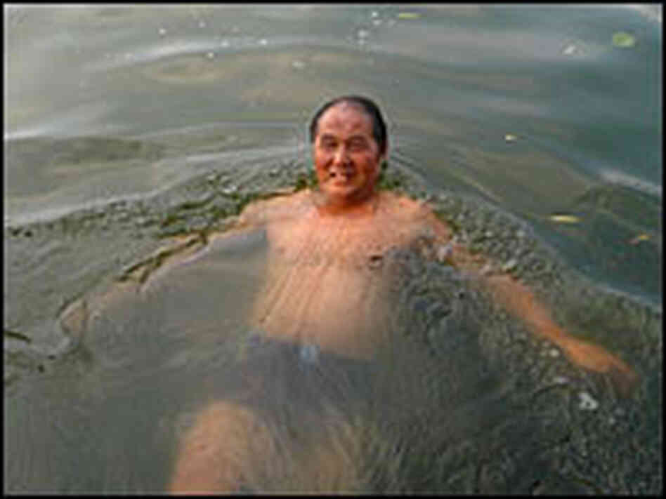 A man swims in Houhai, one of Beijing's lakes.