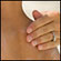 A woman applies sunscreen to a boy's back. Credit: iStockphoto.com