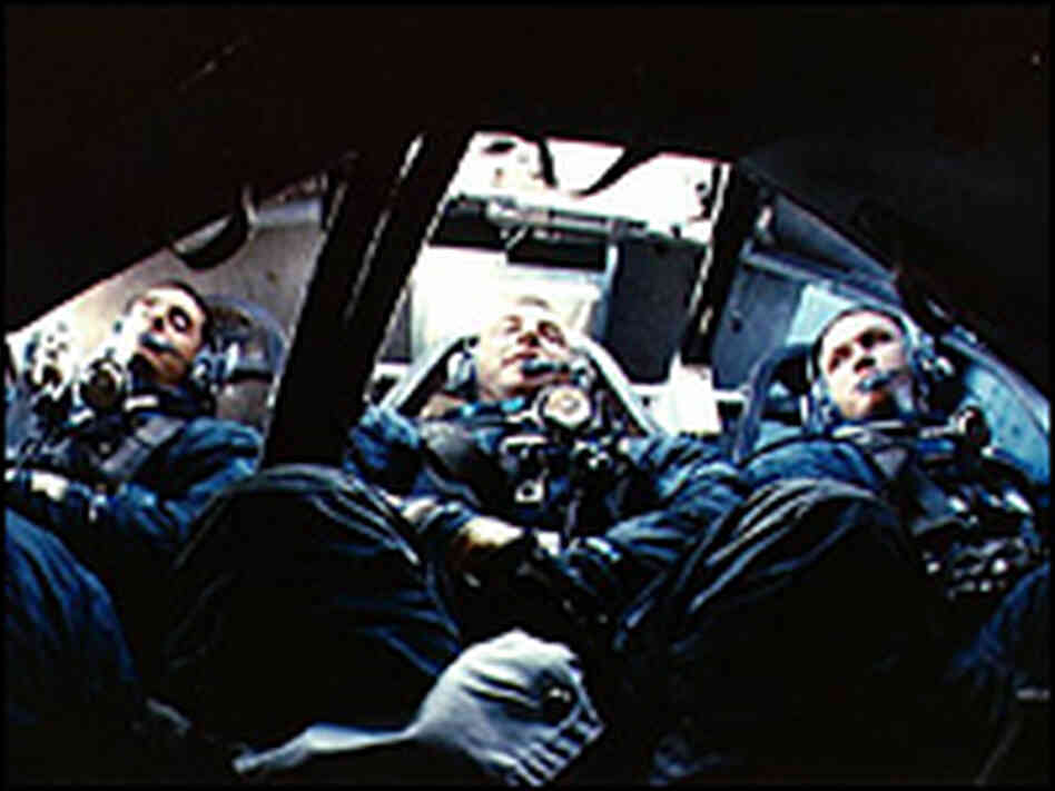 The first three humans ever to orbit the moon are shown returning safely to Earth. The first three humans ever to orbit the moon are shown returning safely to Earth.
